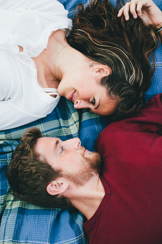 engagement session in the woods, surrounding a fire with smores and flannel in autumn