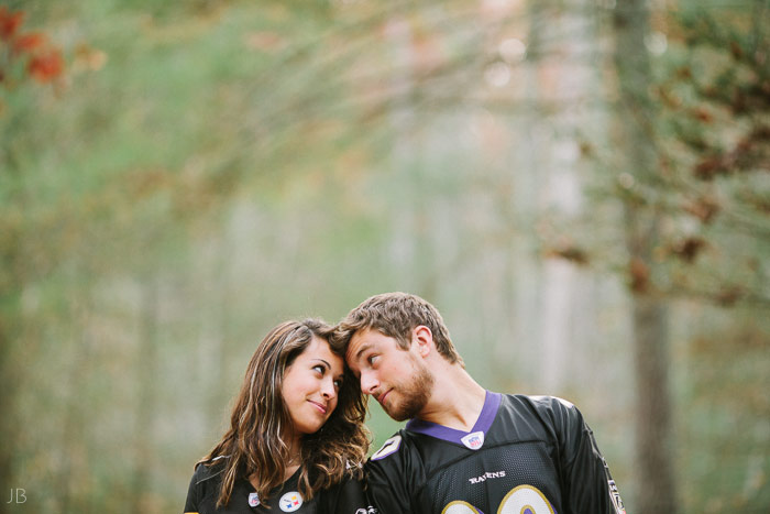 engagement session in the woods, surrounding a fire with smores and flannel in autumn