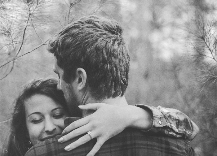 engagement session in the woods, surrounding a fire with smores and flannel in autumn