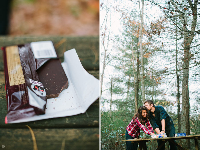 engagement session in the woods, surrounding a fire with smores and flannel in autumn