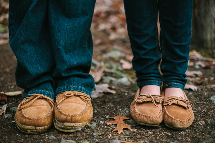 engagement session in the woods, surrounding a fire with smores and flannel in autumn