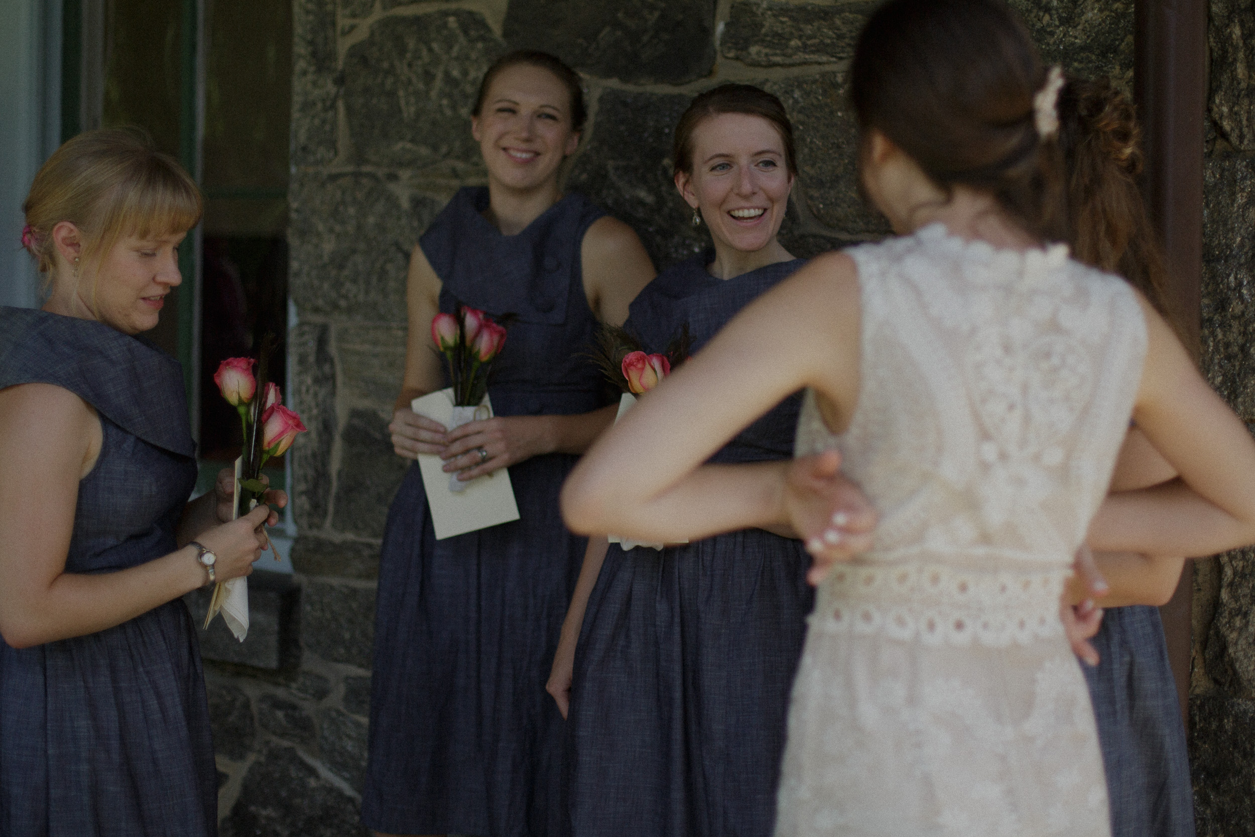 bridesmaids smiling at bride before wedding - true to life film wedding photography look - philadelphia documentary wedding photographer