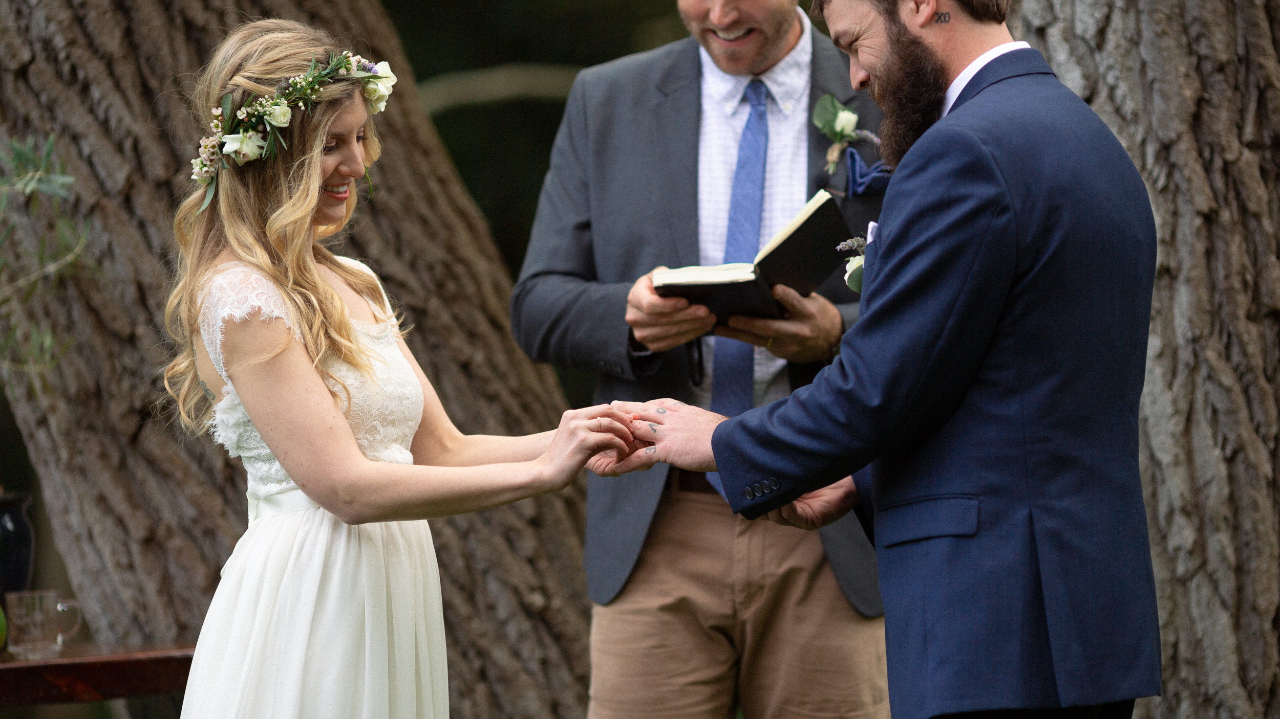 closeup of bride putting ring on groom  - big sur california wedding - laid back wedding in big sur california - fuji provia film look true to life colors