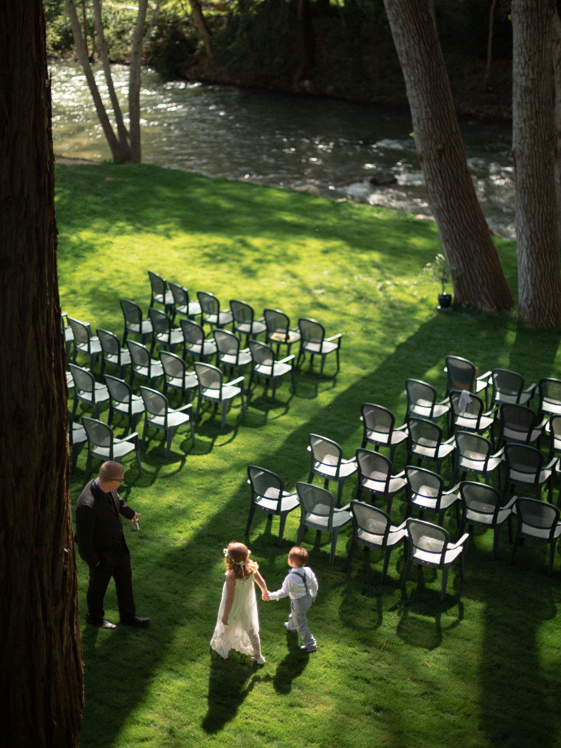 birds eye view of children practicing walking into wedding ceremony - big sur california wedding - laid back wedding in big sur california - true to life colors