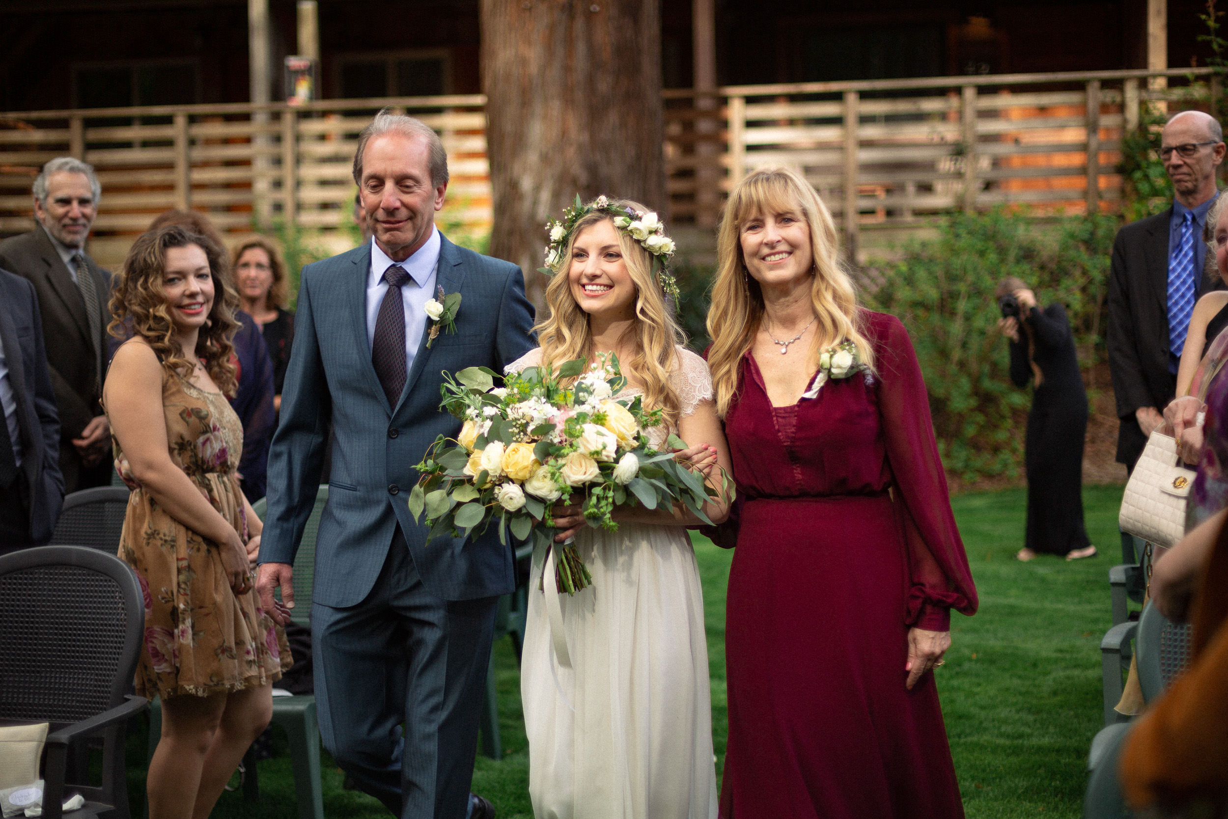 bride enters wedding ceremony with her parents  - big sur california wedding - laid back wedding in big sur california - fuji provia film look true to life colors