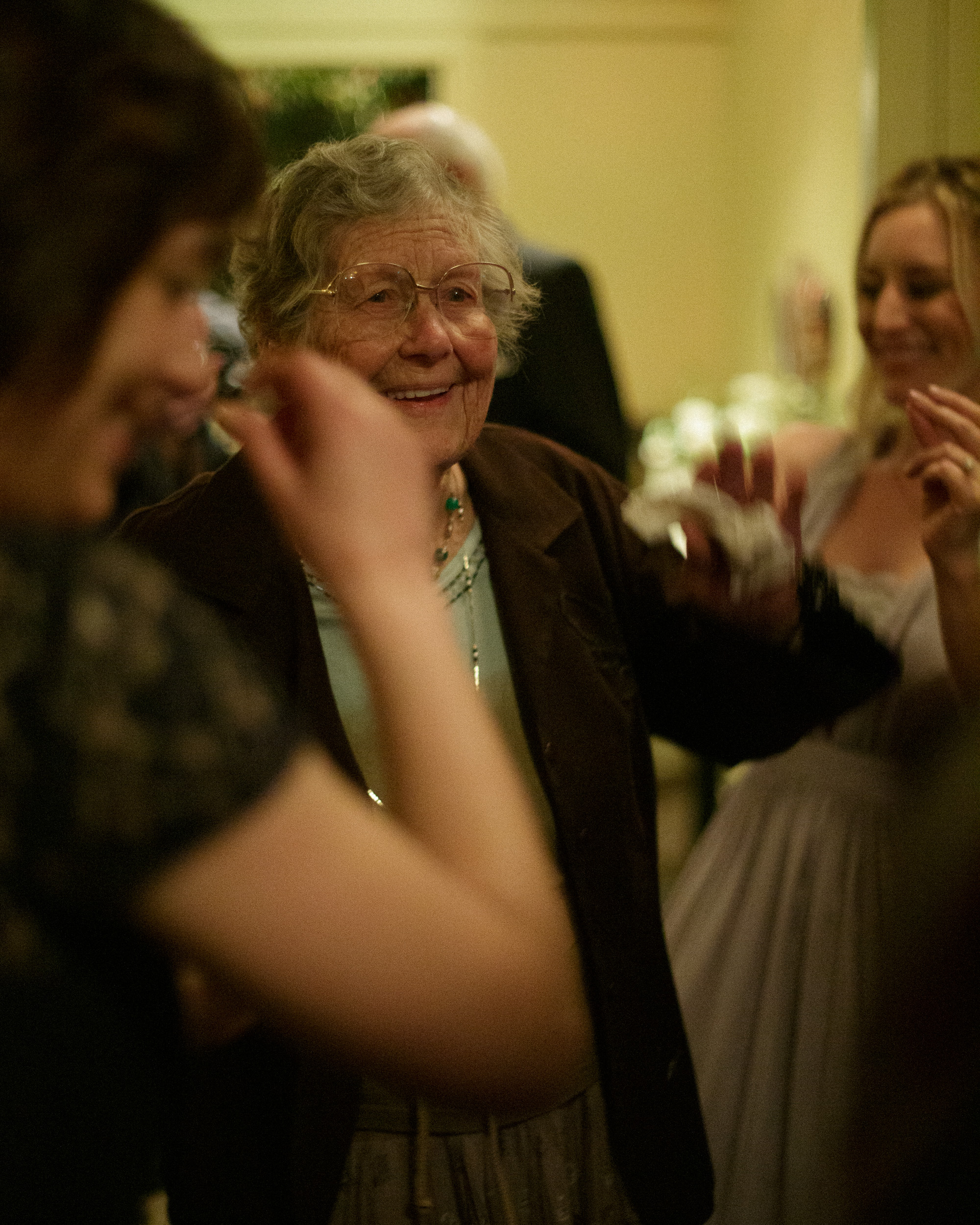 grandmother dances and smiles documentary photography unstaged moment - big sur california