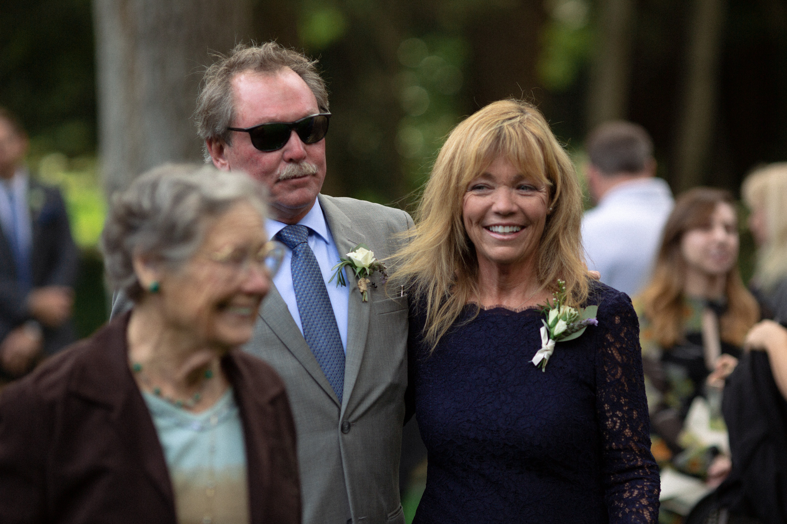 family members exit wedding ceremony happily - big sur california wedding - laid back wedding in big sur california - fuji provia film look true to life colors