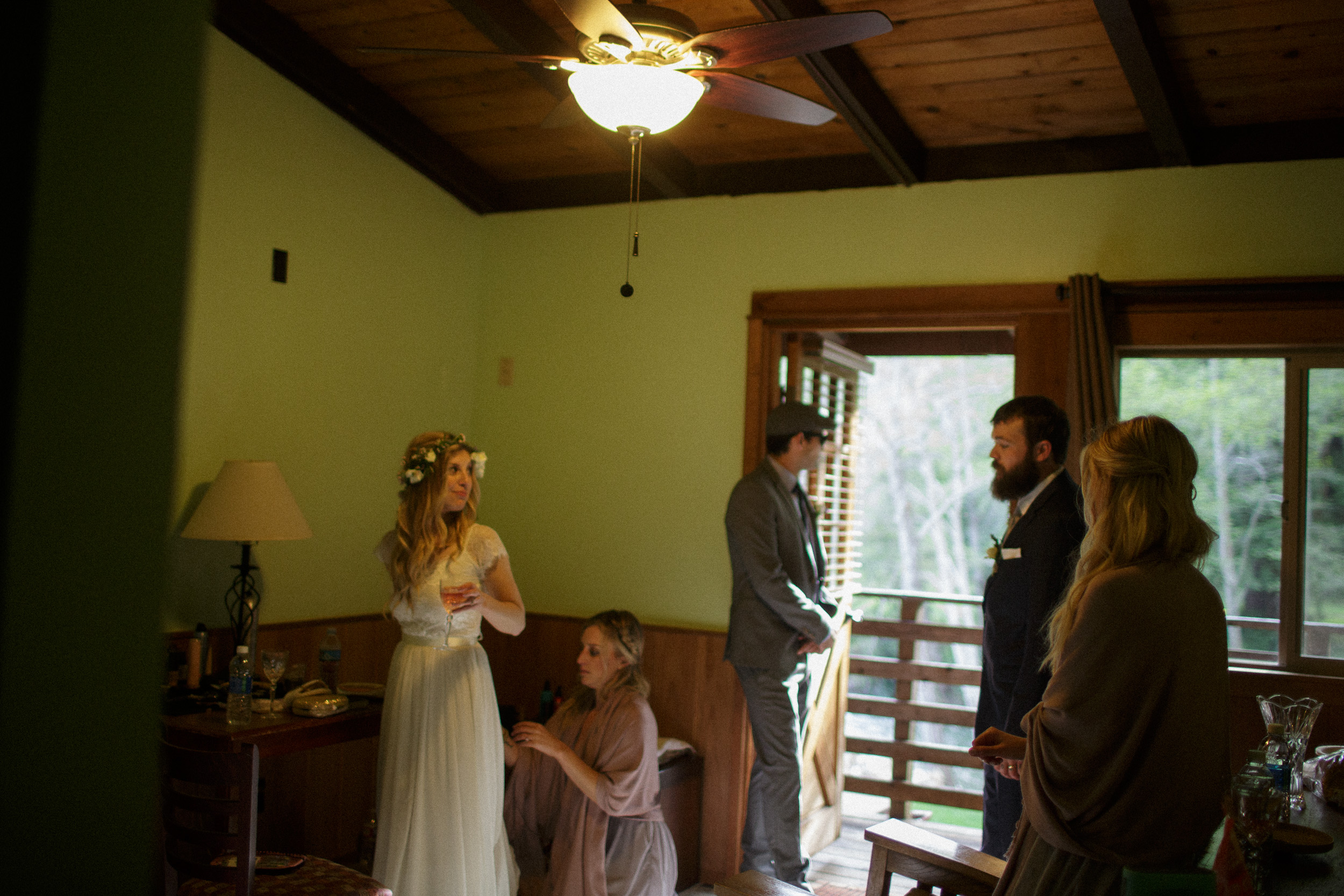 bride getting ready grainy film photography documentary style wedding photo - Big Sur California documentary photography